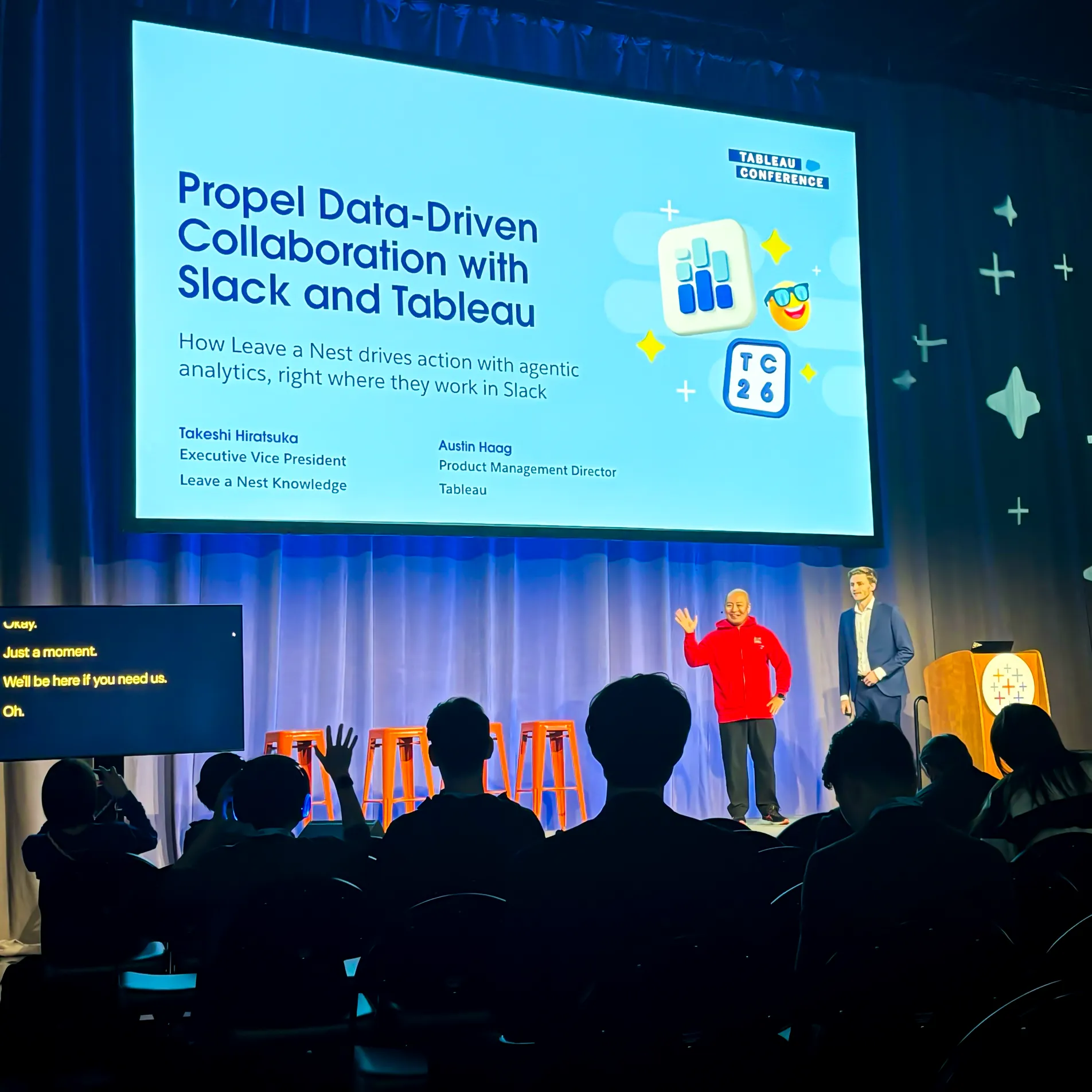 On stage at Tableau Conference 2026, in front of the title slide of Propel Data-Driven Collaboration with Slack and Tableau